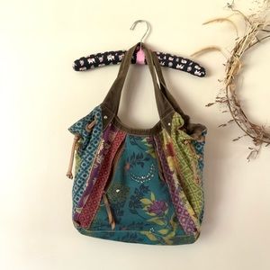 Canvas Fossil satchel with floral bird design